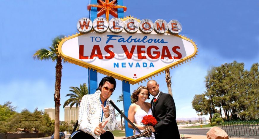 posing by the vegas sign